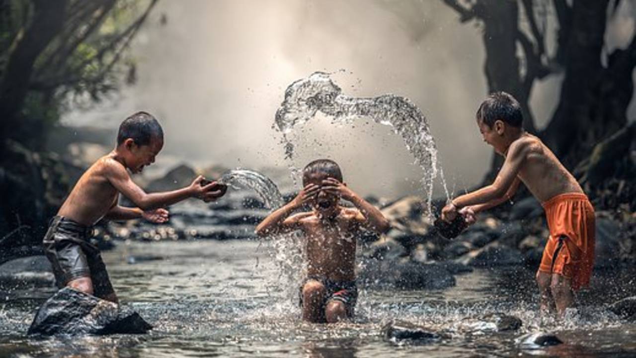 boys_splashing__January_11_is_Step_in_a_Puddle_and_Splash_Your_Friends_Day_pixabay_image.jpg