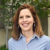 Nancy Heisel, "Never Underestimate the Power of a Redhead" (RLAH Real Estate)