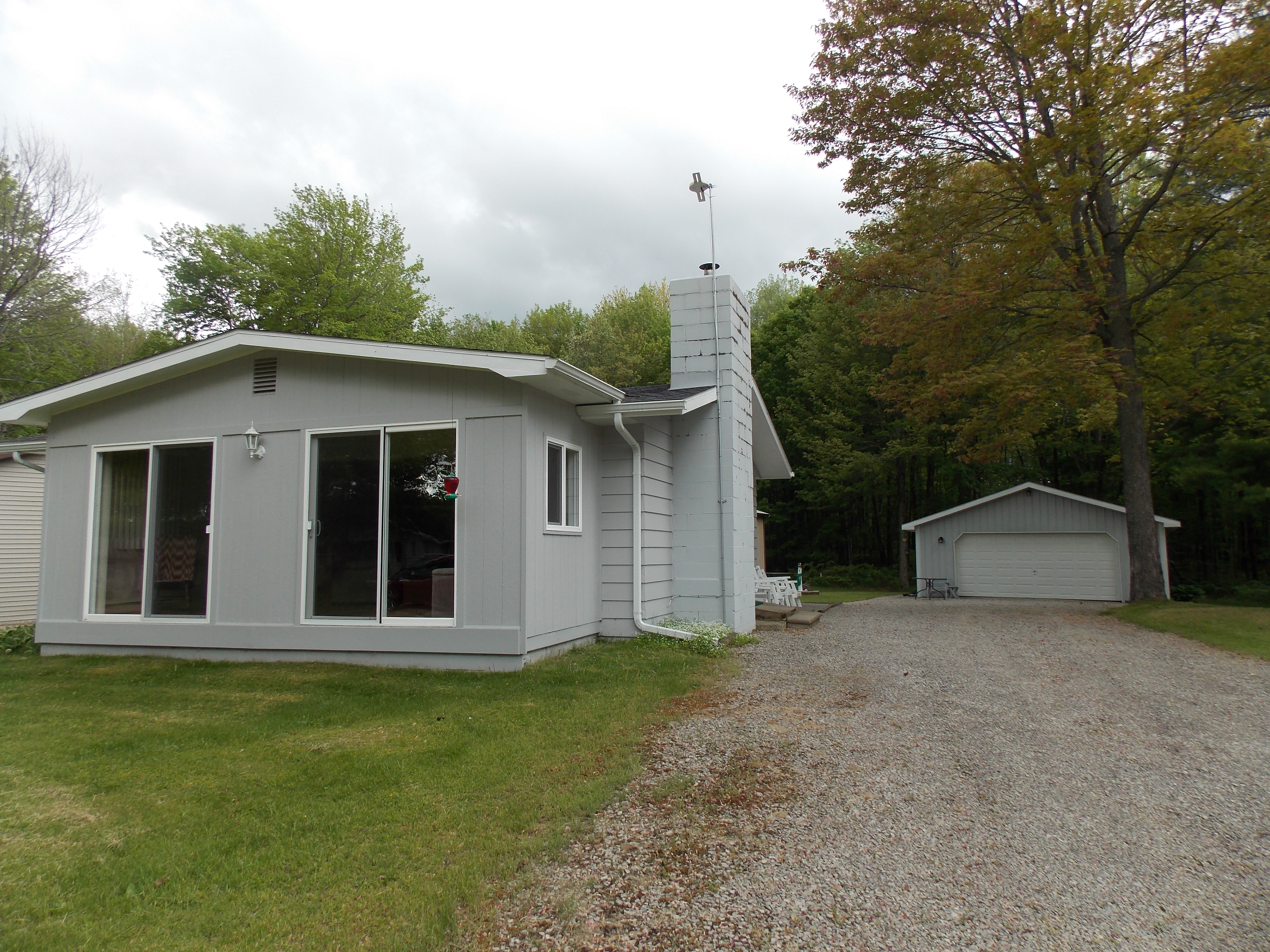 Long Lake Home on 18 Wooded Acres in Clare County