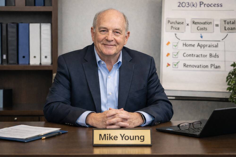Mike_Young_sitting_at_a_desk.png