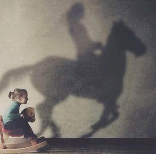 Dream_Big_little_girl_w_shadow_of_horse_on_wall.jpg