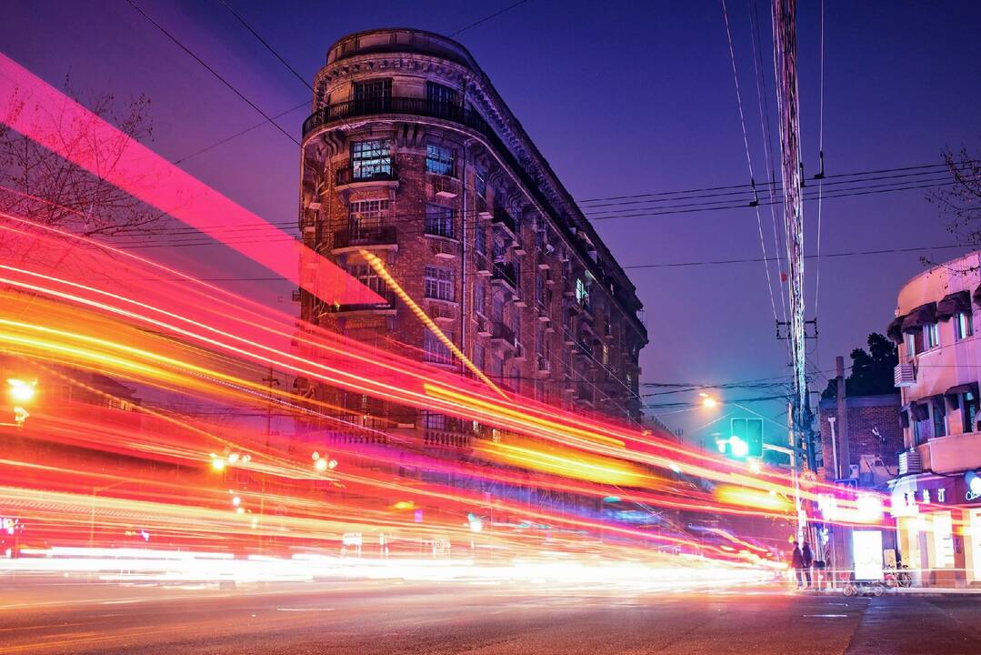 time-lapse_photography_of_cars_passing_through_the_road_between_buildings_during_night_time_(1).jpg