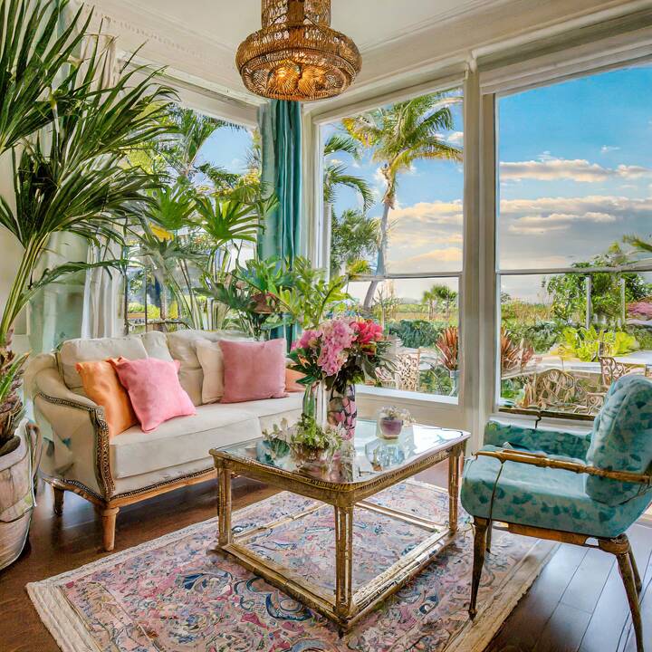 Firefly_living_room_decorated_in_a_preppy_coastal_florida_style__with_pastel_colors__brass_and_glass.jpeg