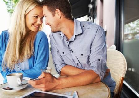 young_couple_at_table_with_coffee_small.jpg