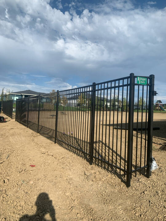 6’_tall_Black_Ornamental_Steel_Fence_with_3_Rails_and_Flat_Top_by_Acreage_Fences_in_Papillion__Nebraska._2.jpg