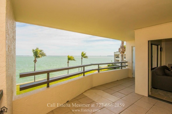 Townhouse for Sale in Tierra Verde FL - Unwind while enjoying the stunning view of the waters of Boca Ciega Bay in the large balcony of this Tierra Verde townhouse.